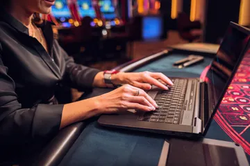 A laptop glowing with a bright login prompt in a minimalistic setup, symbolizing the protected access system at CD44.